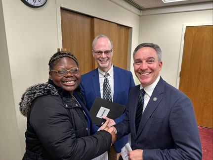 Student Jessica Gilbert and Director of the Sustainability Institute and the Office of Government and Community Affairs Neal Lewis with NYS Senator Jack Martins