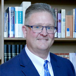 Headshot of Brian McNeill, CFO and Treasurer