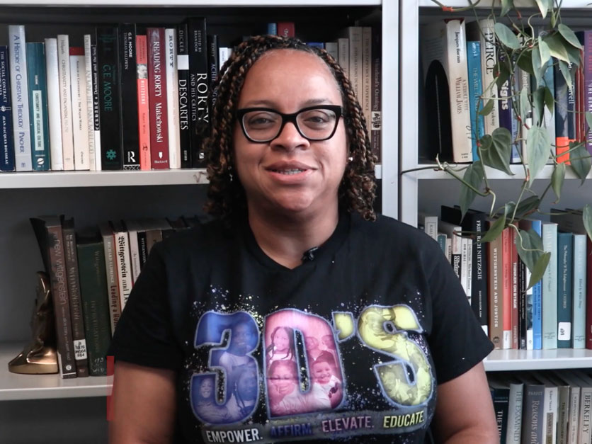  Dr. Zodelia Williams in front of a bookshelf filled with books and a leafy plant as she discusses the impact of our internship and community work-study placements on student learning and community partnerships.