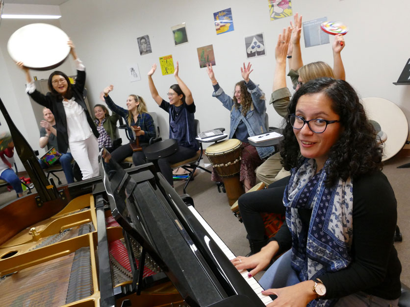 Music therapist at piano