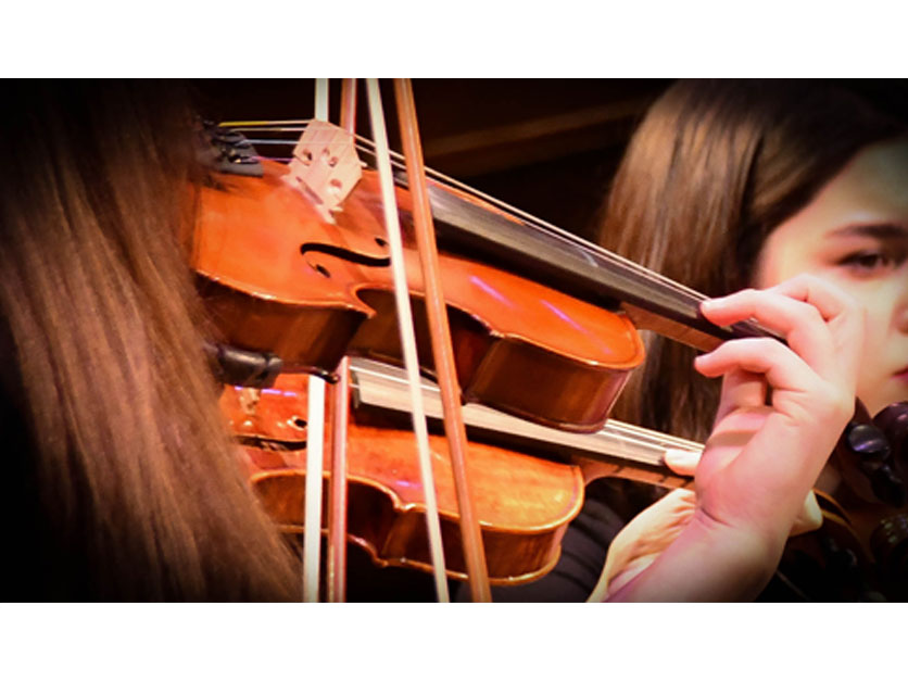 Students playing violins