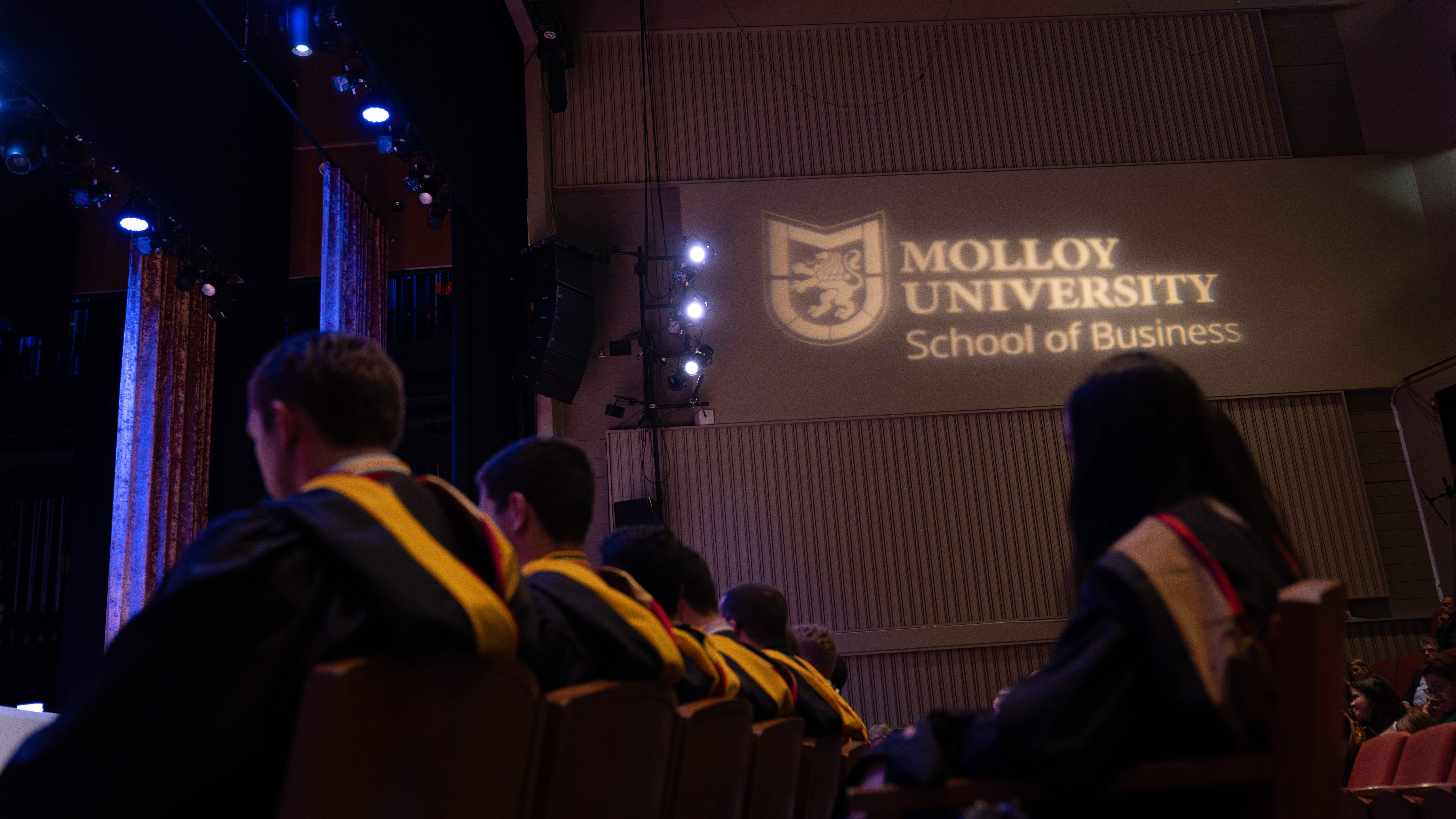 School of Business students sitting together at Class Night