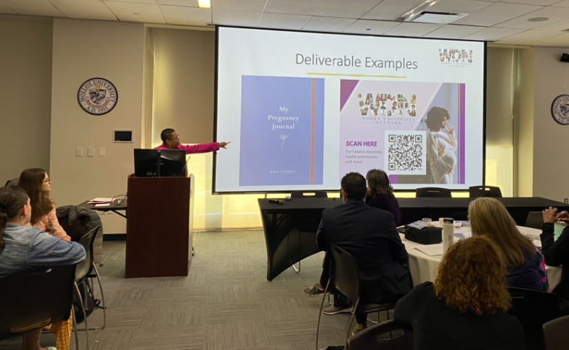 Cindy Thomas presenting to the conference attendees