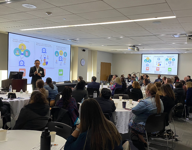 Dr. Alex Chan presenting to conference attendees