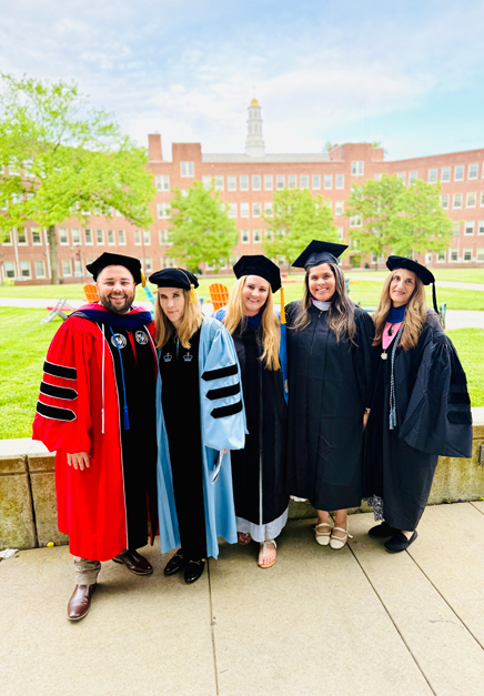 Photo of the clincial mental health staff posed together in graduate regalia