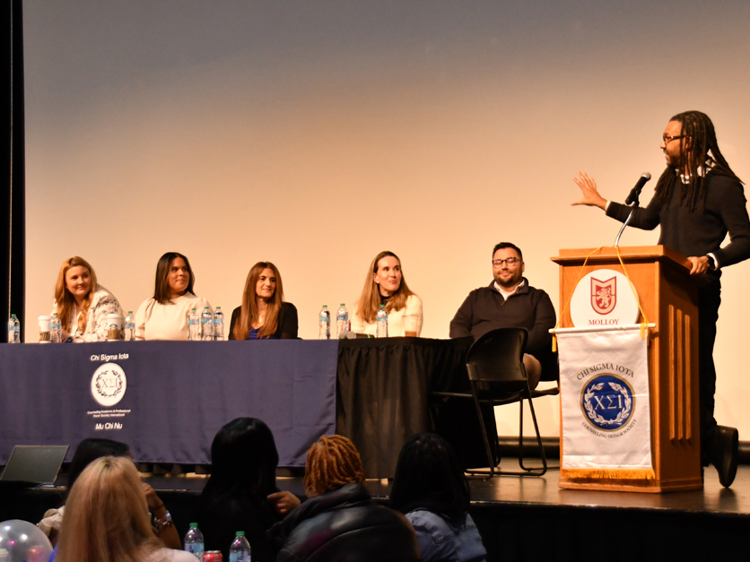 Faculty listening to the keynote speaker, Dr. Tyce Nadrich, at the 2025 CSI Initiation event