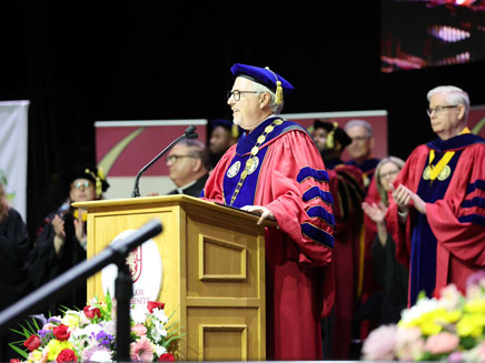 Dr. James Lentini speaking to Molloy University graduates