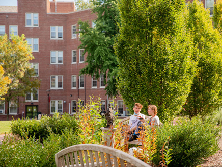 Students sitting in Shakespeare Garden