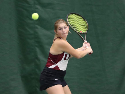 Molloy University Student playing tennis