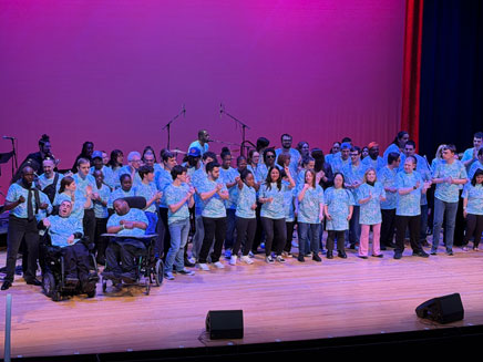 Performers from the neurodivergent community, each sharing their talents through music, dance, poetry, storytelling, and visual art at the Madison Theatre on the Molloy's Rockville Centre campus.