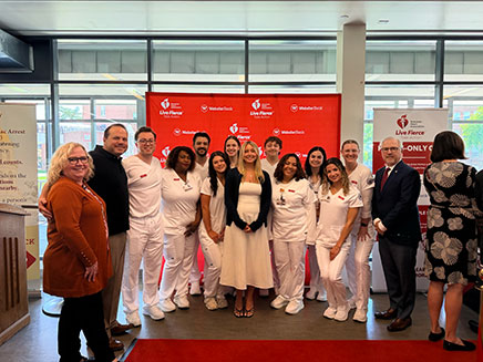 Molloy Unviersity student, Saige Colleluori, Provost and Vice President for Academic Affairs, Michelle Piskulich, and President of Molloy University, James Lentini, with other Molloy University students at the Molloy University HeartSafe event.
