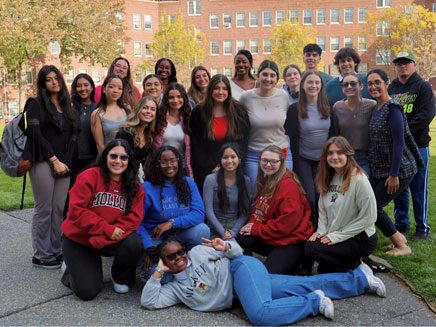 MolloyLife Media, Molloy University’s student media team, posing on campus after receiving awards for excellence in social media and storytelling.