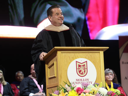 Matt Higgins speaking at the 2024 Molloy University Commencement