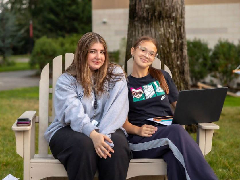 Two students enjoying McGovern Plaza