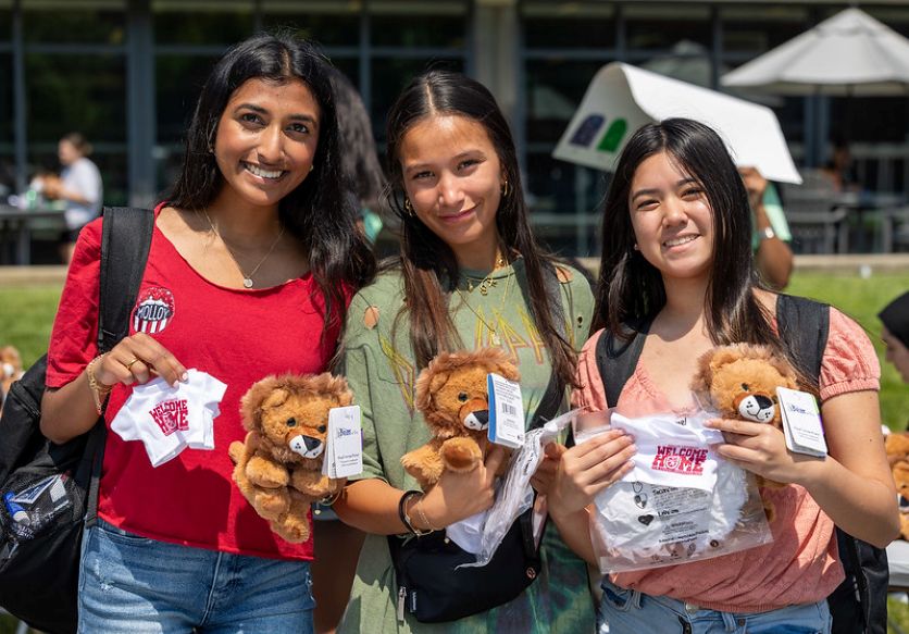 Students enjoying their stuffed lion at the Orientation Carnival 2024