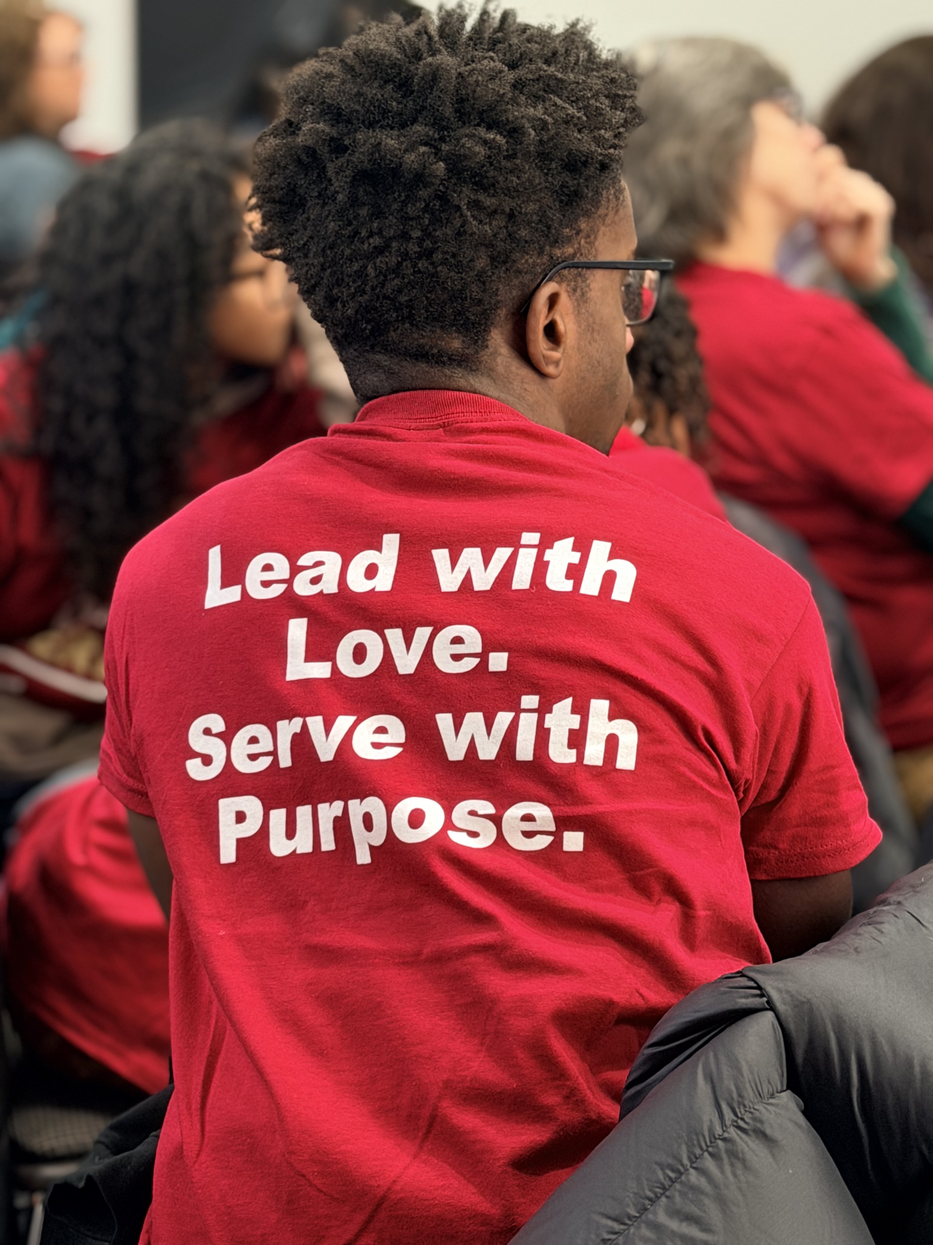 Back of MLK Day of Service t-shirt showing the theme, "Lead with Love. Service with Purpose."
