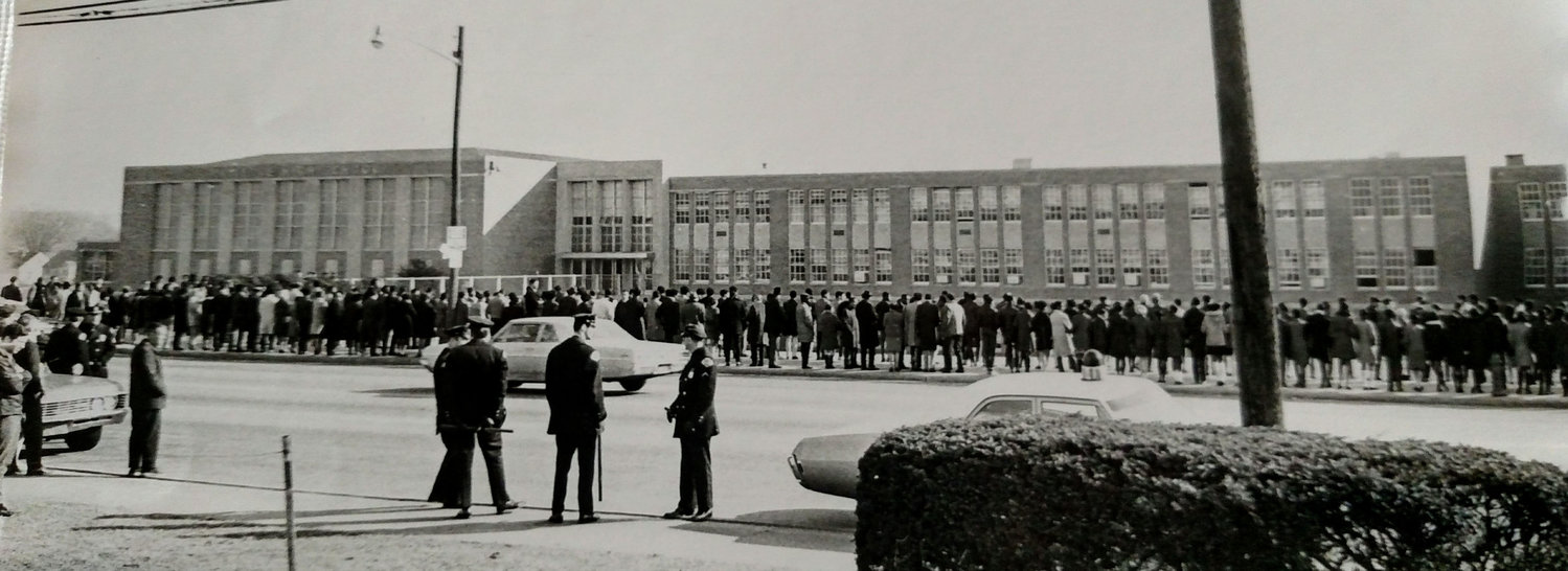 Photo of protesters outside of school