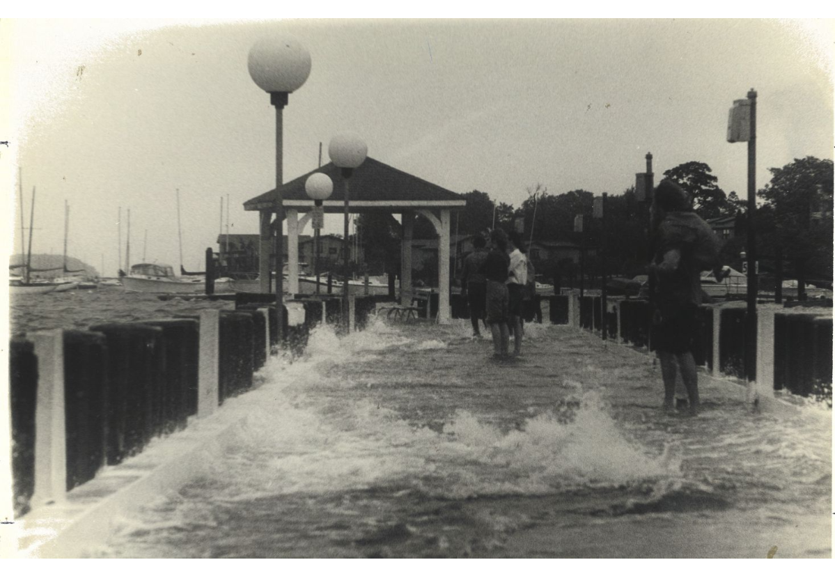 Photo of flooding near a harbor during Hurricane Gloria