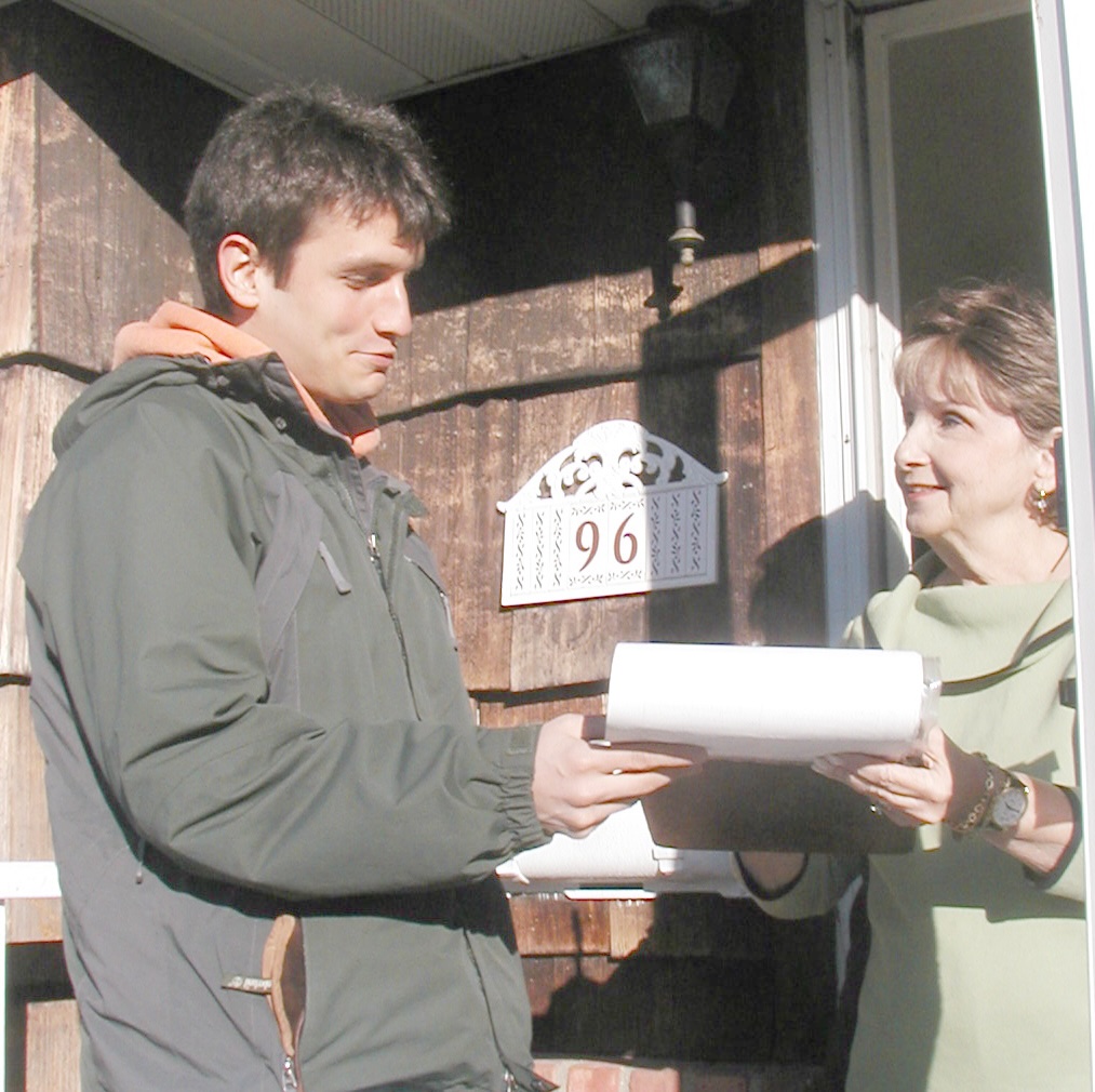 Photo of canvasser speaking with homeowner