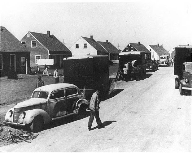 photo of moving trucks and Levittown homes