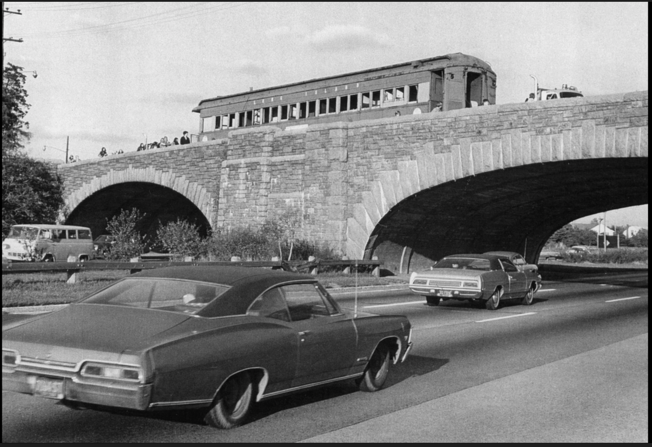 Picture of the low-arched bridge over a parkway