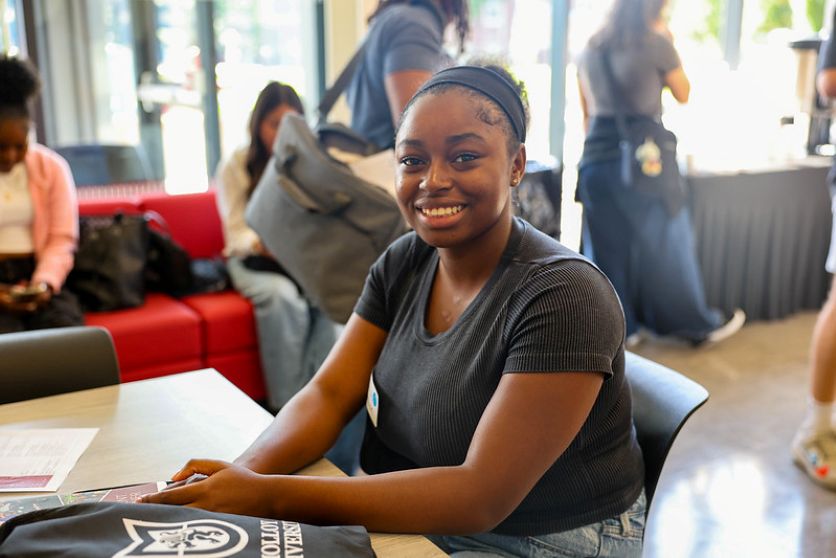 incoming student smiling at orientation