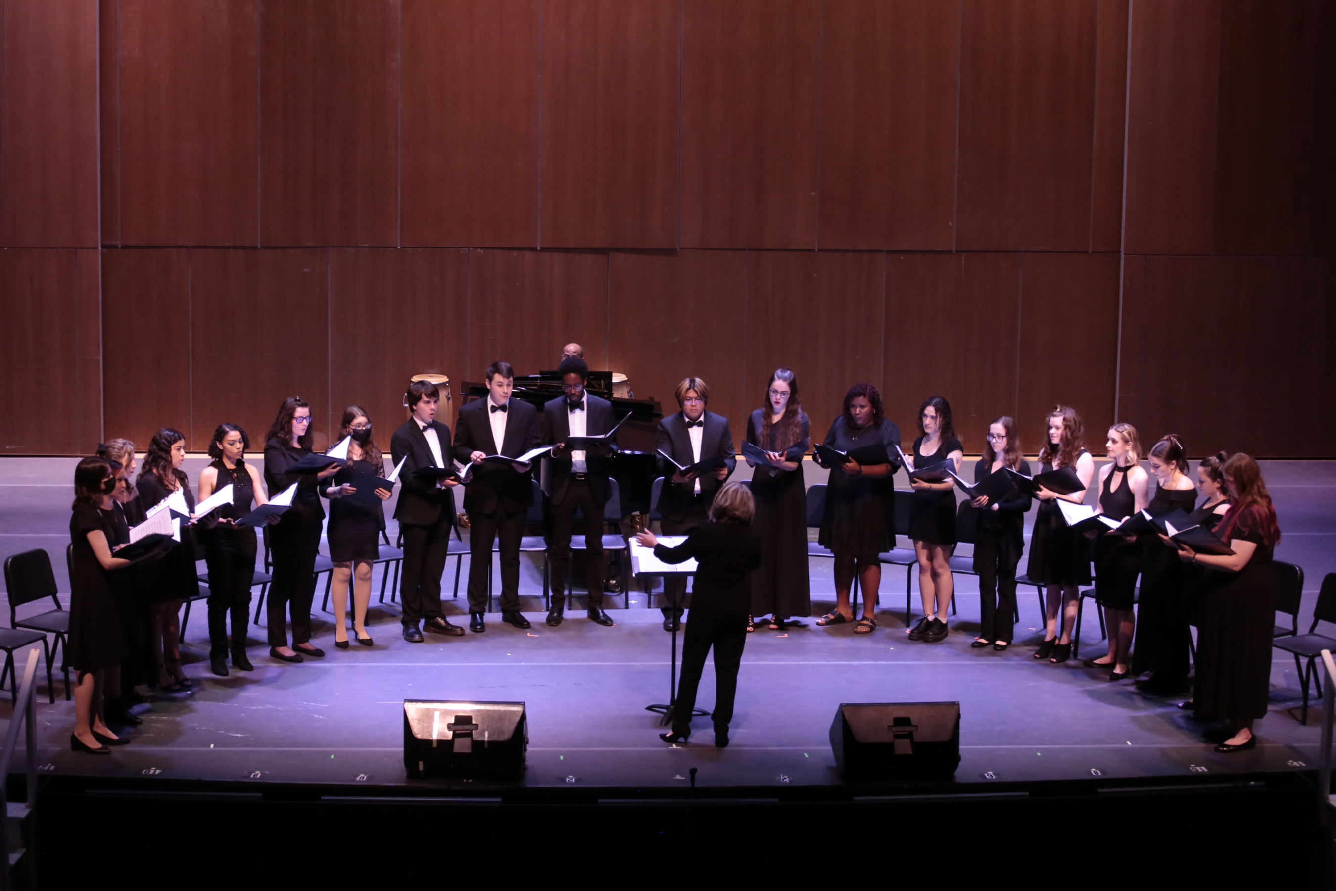 A group of vocalists performing at Molloy University
