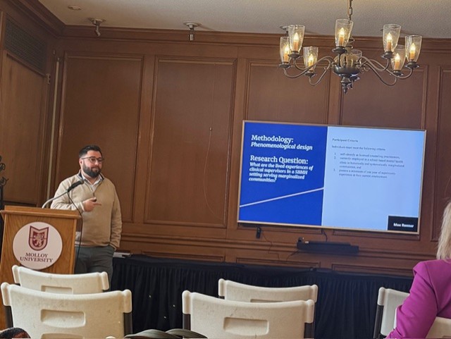 Dr. Blanchard presenting at Faculty Research Day 2026