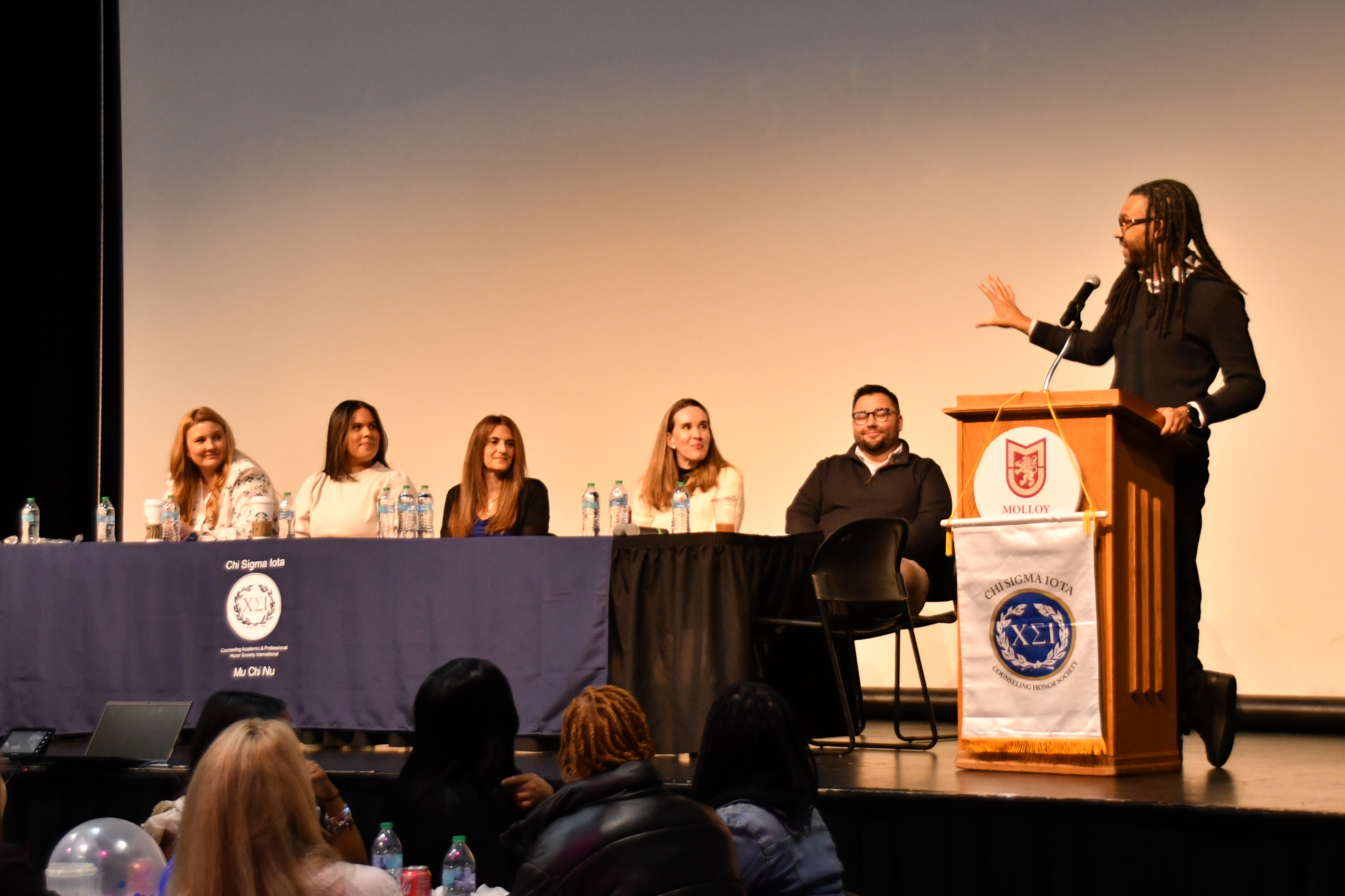 Faculty listening to the keynote speaker, Dr. Tyce Nadrich, at the 2025 CSI Initiation event