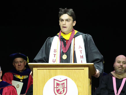 Molloy University 2025 Valedictorian Jason Schwartz speaking at Molloy University Commencement