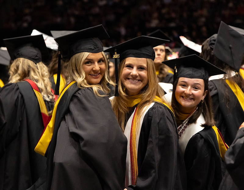 Students in graduation regalia 