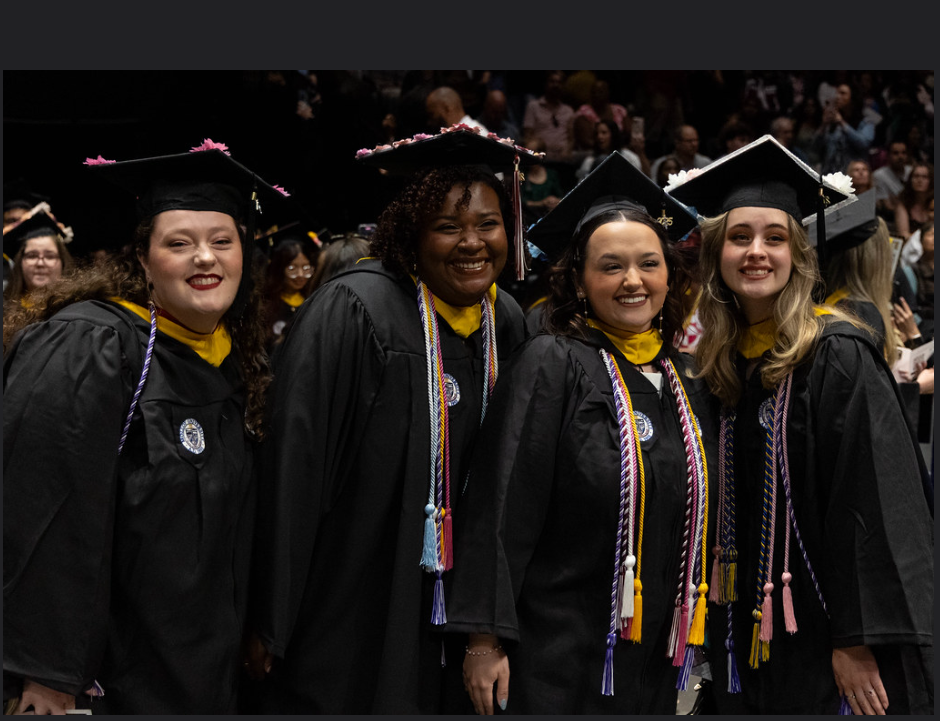 Students in graduation regalia 