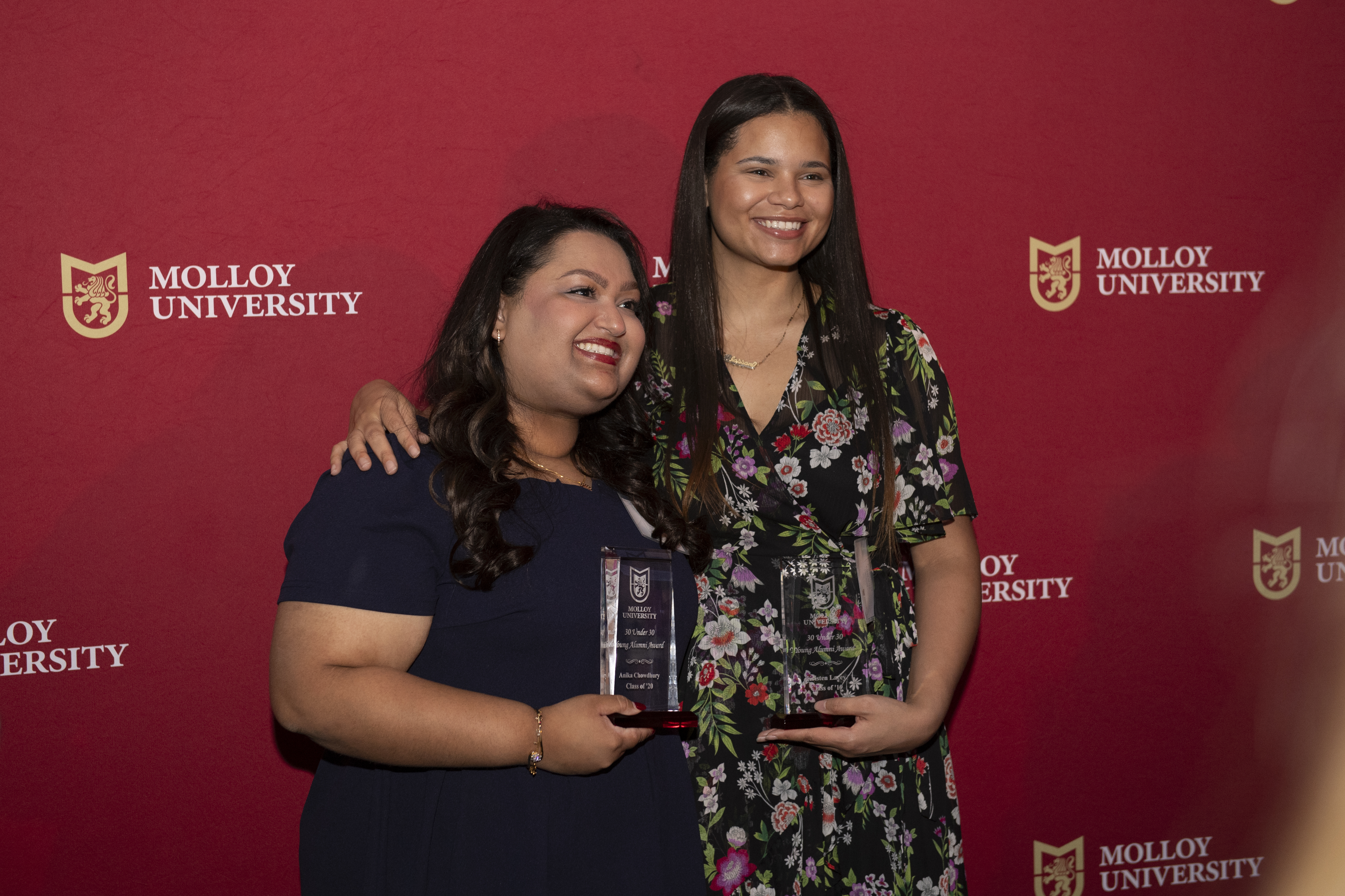 Two Molloy Allumni on campus receiving awards